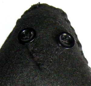 Felt raven face detail