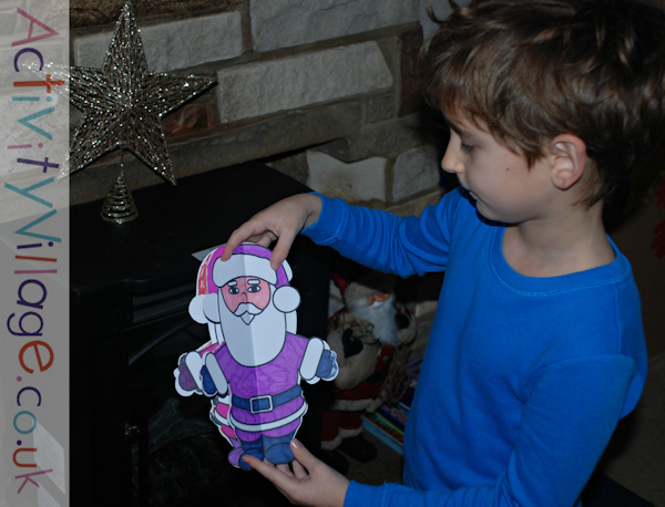 Showing off the lovely Santa he made!