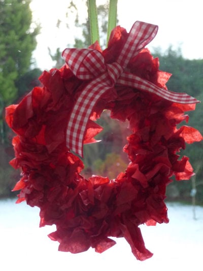 Tissue paper wreath hanging in the window