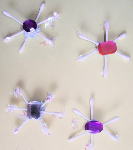 Cotton bud snowflakes on the wall