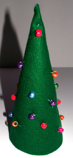 Felt Christmas tree craft for kids with sewn-on beads