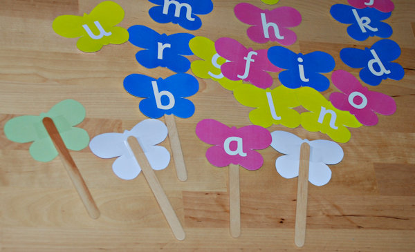 Butterfly letters attached to craft sticks