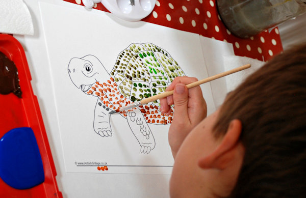 Creating his dotty tortoise