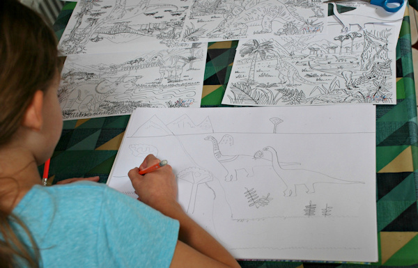 Dinosaur scene drawing using colouring pages for inspiration