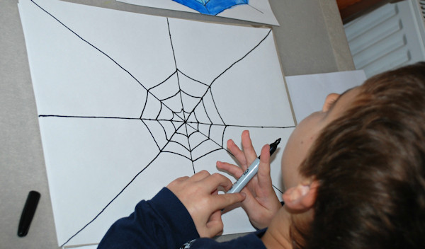 Drawing his spider web