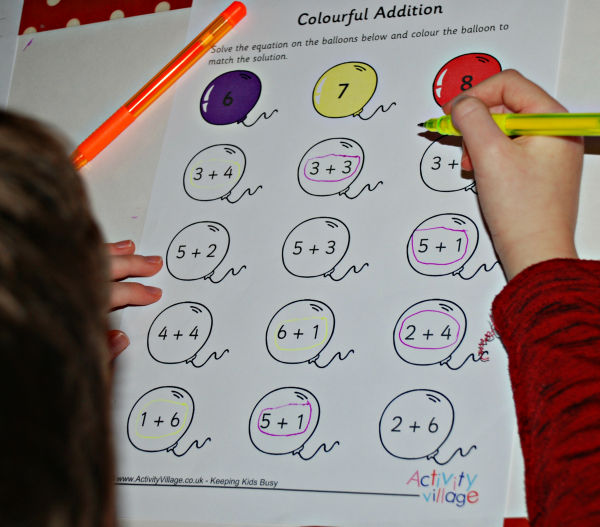 Circling the correct sums on balloons with coloured pens rather than colouring them in