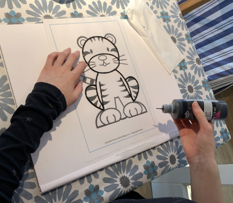 Going over the simpler tiger colouring page with puffy paint