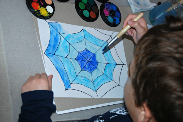 Painting his first spider web