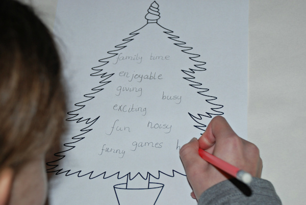 Jotting down words for her Christmas story