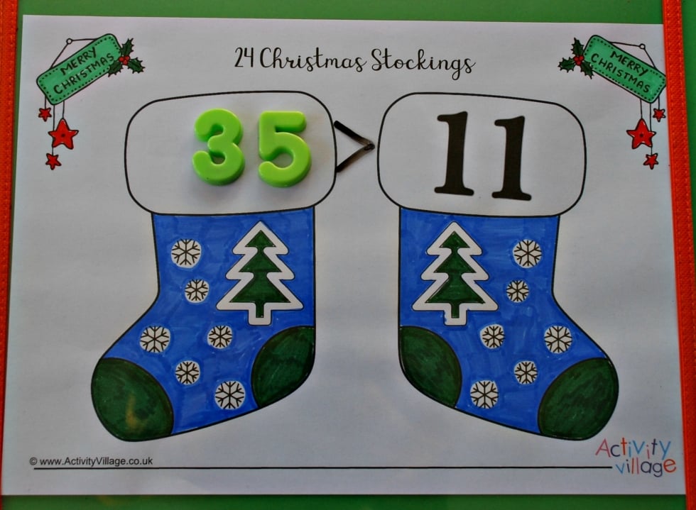 Christmas stockings used for "greater than" and "less than"