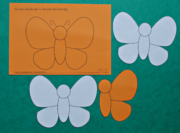 Cutting out the butterfly playdough mat