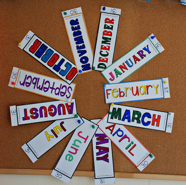 Months of the year colouring bookmarks displayed in a circle on the notice board