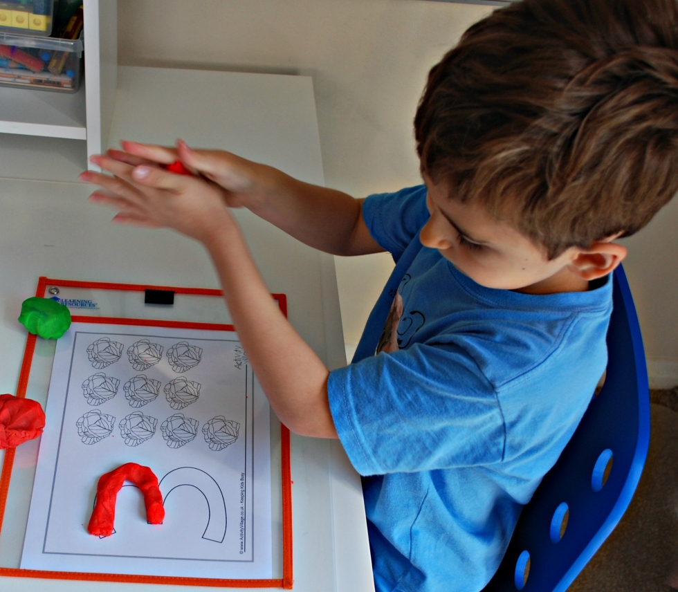 Using our vegetable counting playdough mat for the number 3