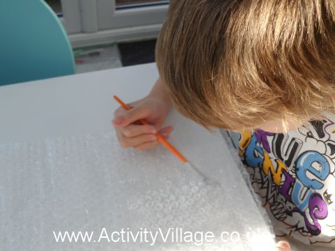 Sam painting the bubble wrap white