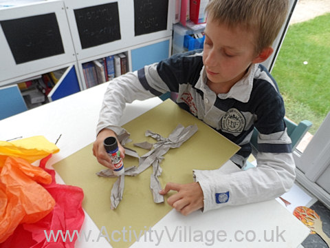 Collage tree - Sam gluing the trunk and branches of his tree