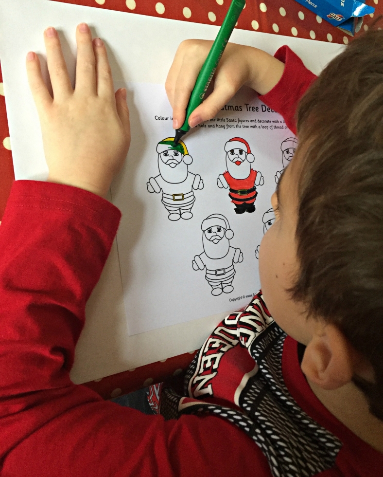 Colouring in the Father Christmas tree decorations