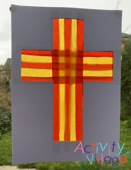 Completed red and gold cross in the window