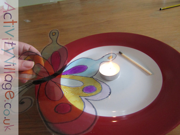 Curling the edges of the acetate butterfly