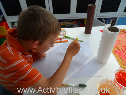 Felt tip watercolour tree - Sam painting a cloud shape onto the paper