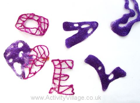 Glitter glue letters, pealed off the plastic
