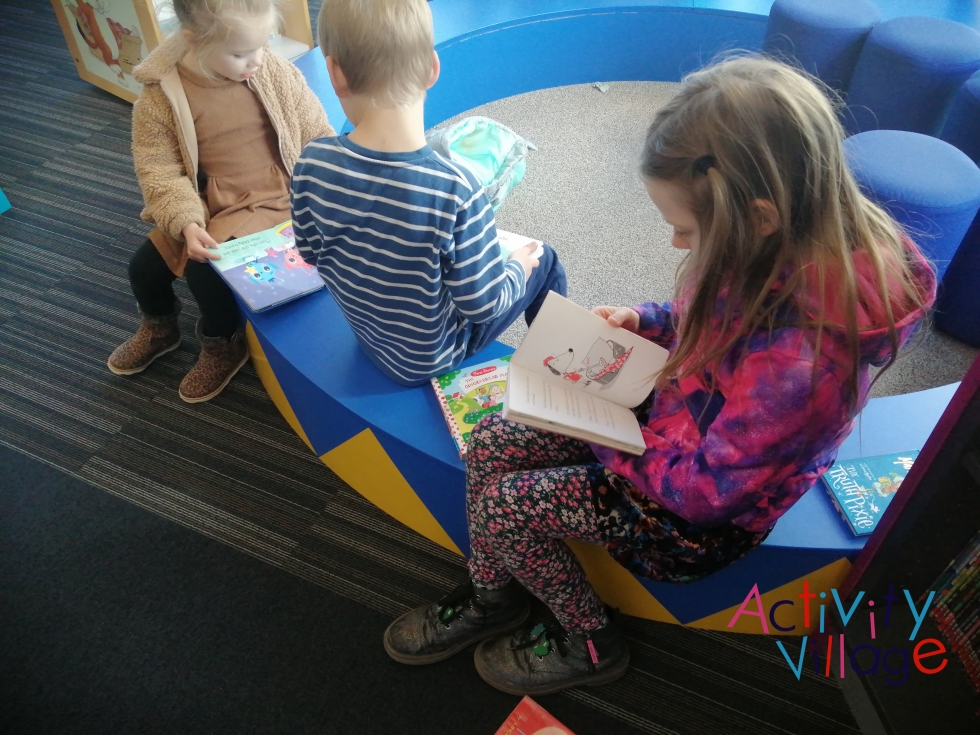 Children reading at the library