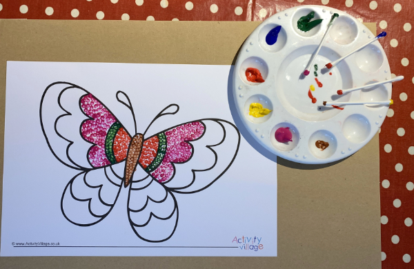 Using a butterfly colouring page and filling it with dots