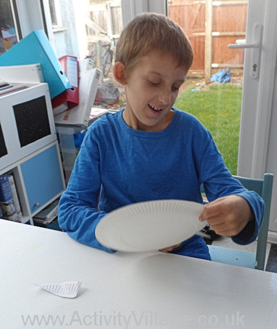 Sam cutting his paper plate ghost