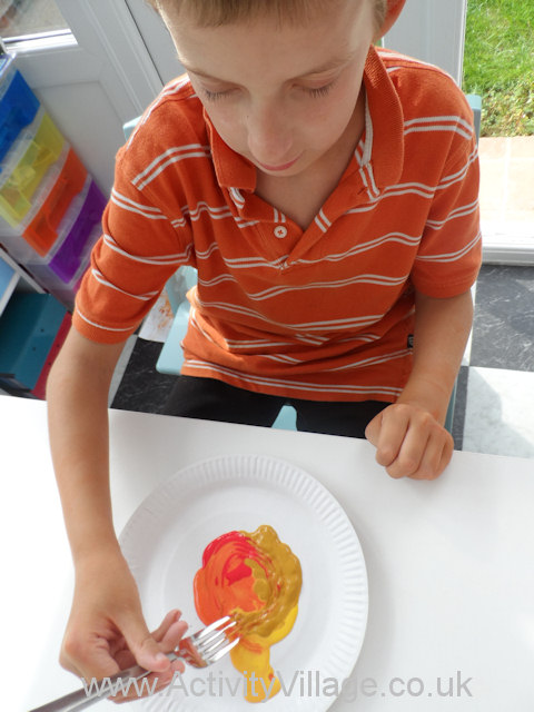 Paper plate marbling tree - swirling the paint together