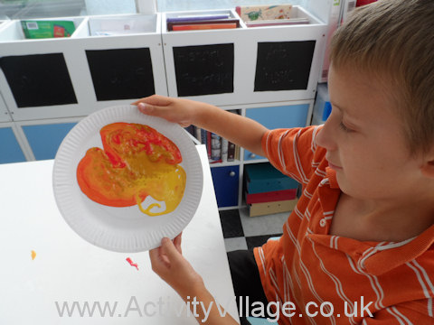 Paper plate marbling tree - tilt the plate