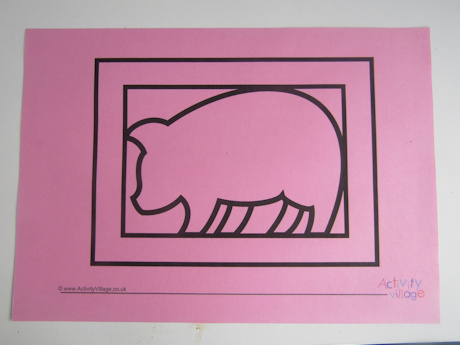 Pig paper cut template printed onto pink paper