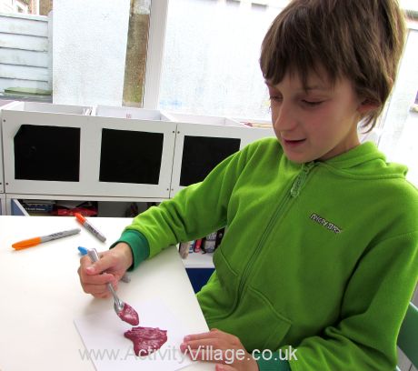 Sam "drawing" his heart in puffy paint
