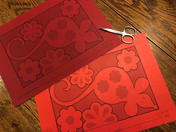 Our rat paper cut template printed out onto 2 different types of red paper