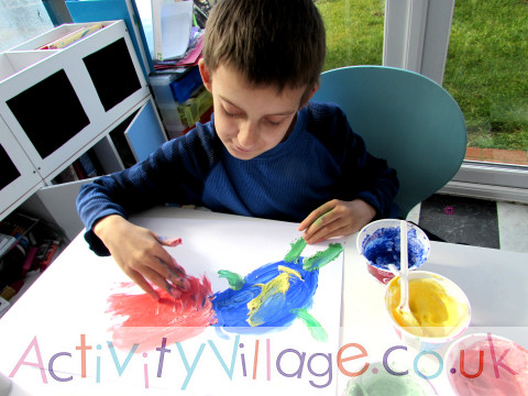 Sam starts his shaving foam painting