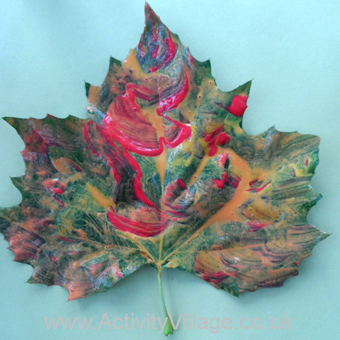 Stamped leaf tree - painting the leaf with different colours of paint