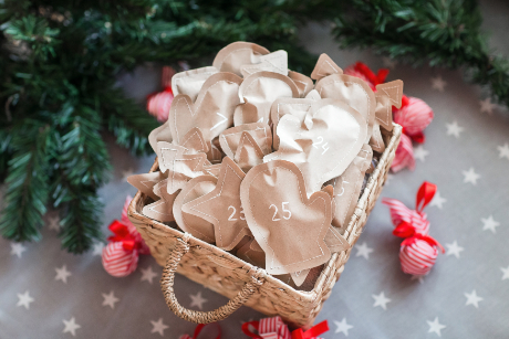 Stitched shapes stacked in a basket for an exciting Advent Calendar