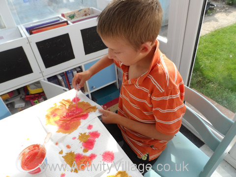 Watercolour leaf bunting - Sam dropping colours onto the kitchen towel