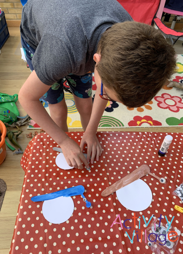 Sticking googly eyes onto our snails!