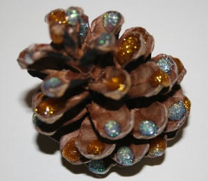 pinecone decoration with glitter glue