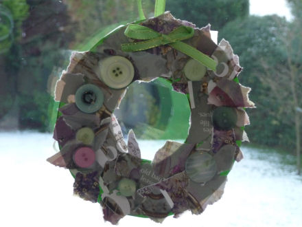 Wreath collage hanging in window