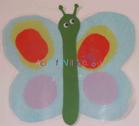 Tissue paper suncatcher butterfly by older child
